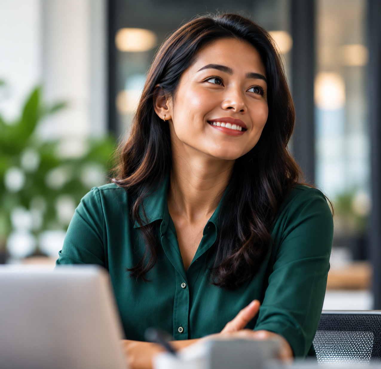 Smiling young professional woman in a modern office